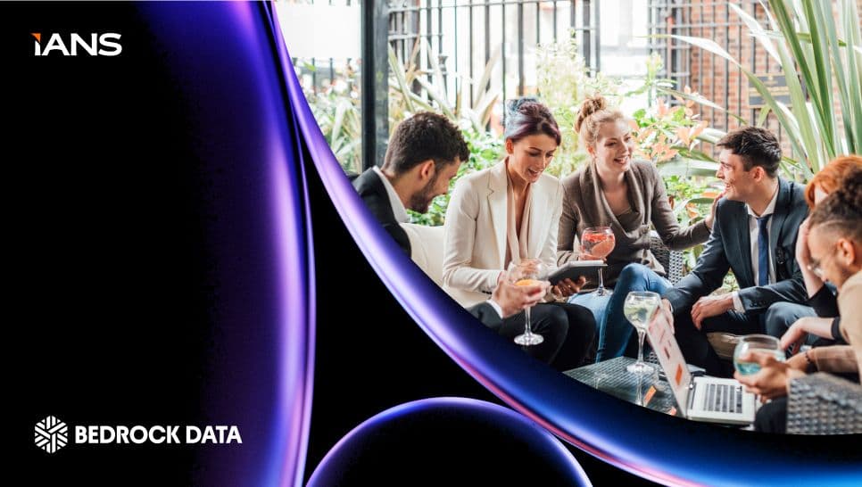 Security professionals networking with drinks at the IANS Suite, with IANS and Bedrock Data logos