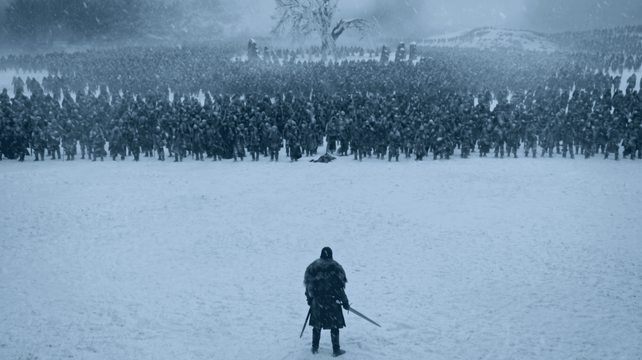 A lone figure with a sword stands in a snowy field, facing a massive army in the distance.